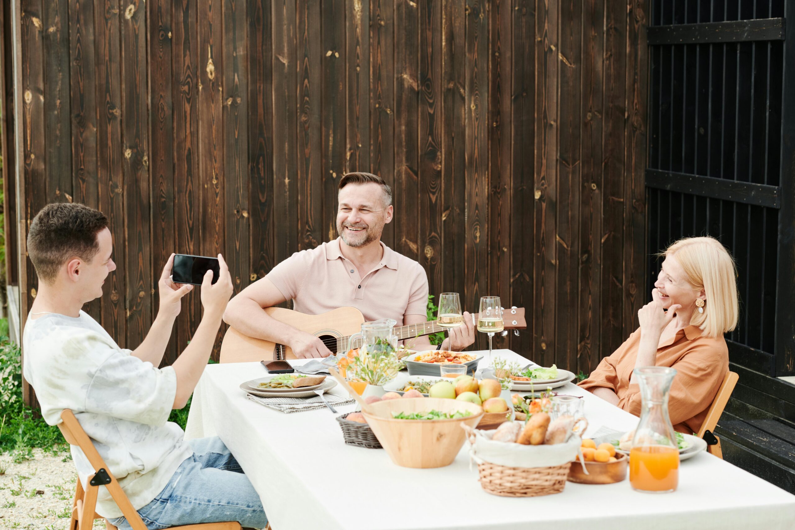 A group photo of a trainer, foster parent, and veterinarian brainstorming together