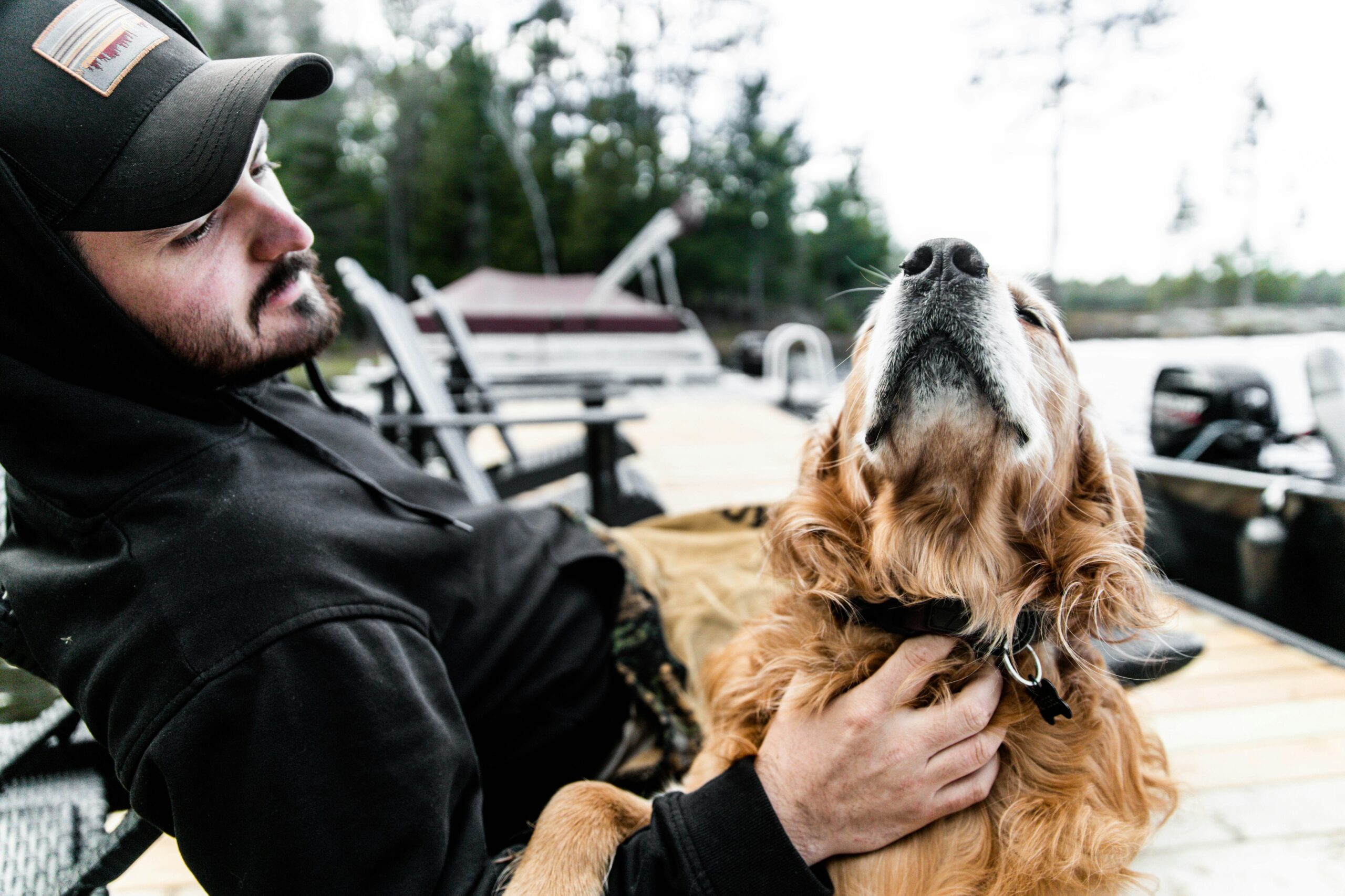 Luna the rescue dog posing with her handler after completing advanced training.