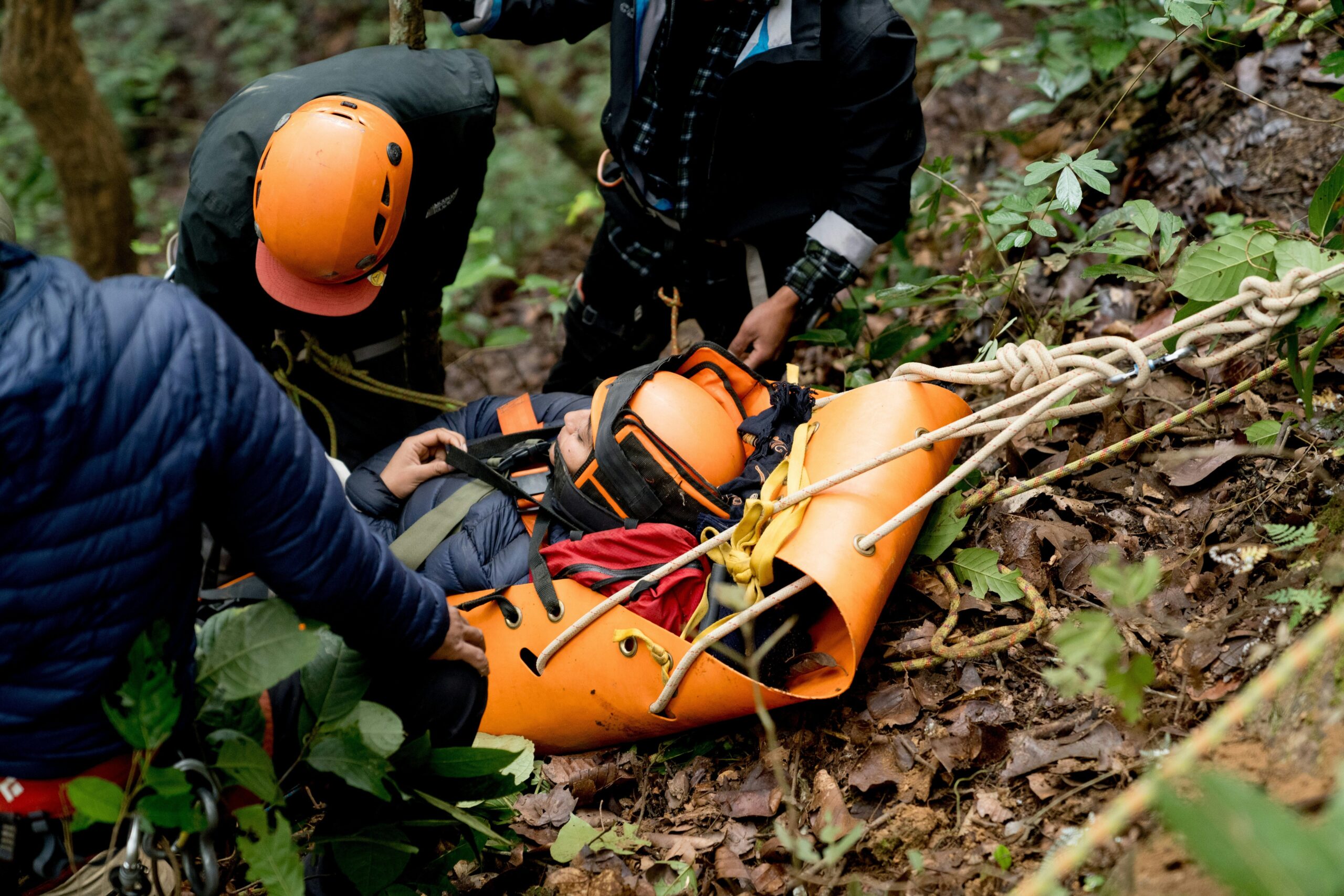 A handler standing proudly next to his trained SAR dog