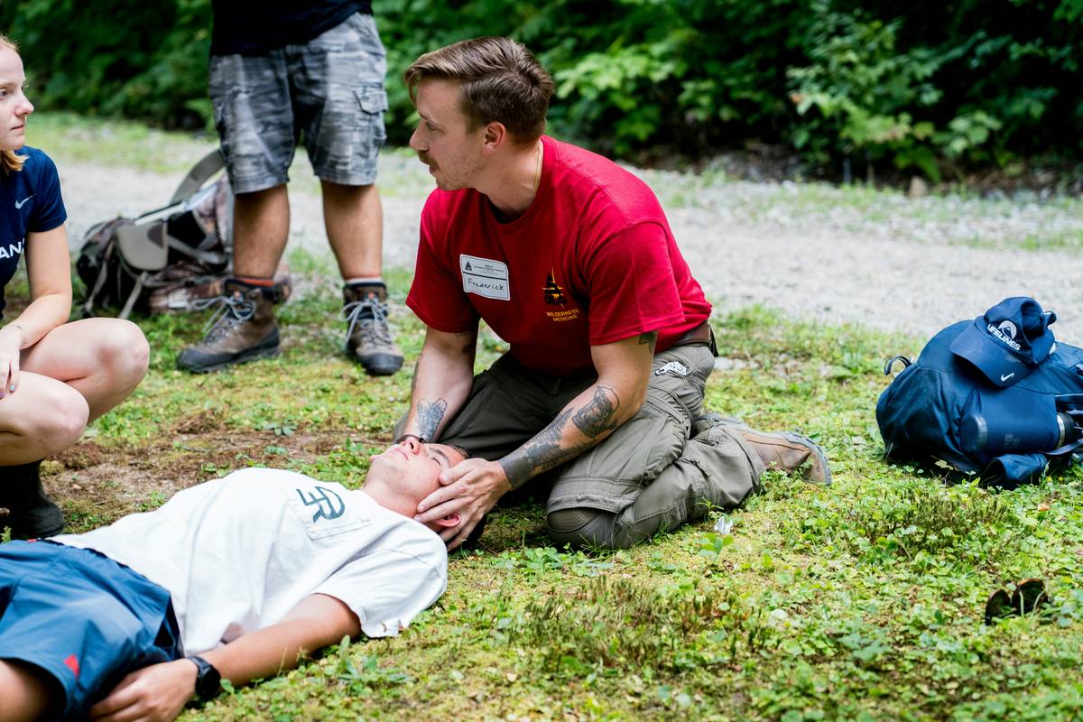 A group of people planning a dog training session around a table